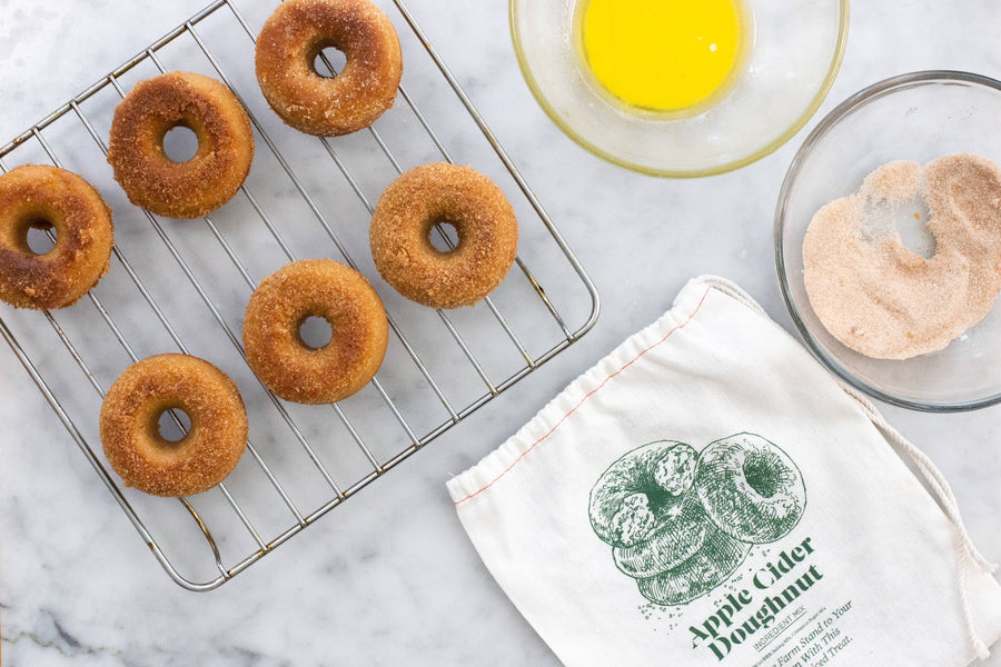 Warm apple cider doughnuts dusted in cinnamon sugar